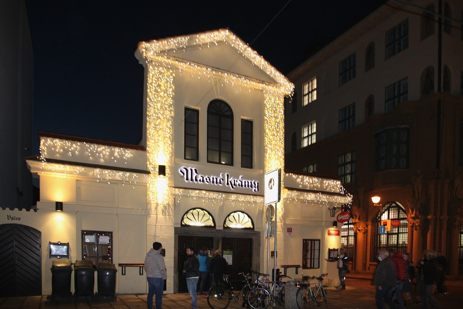 The illuminated Masné krámy beer hall in České Budějovice