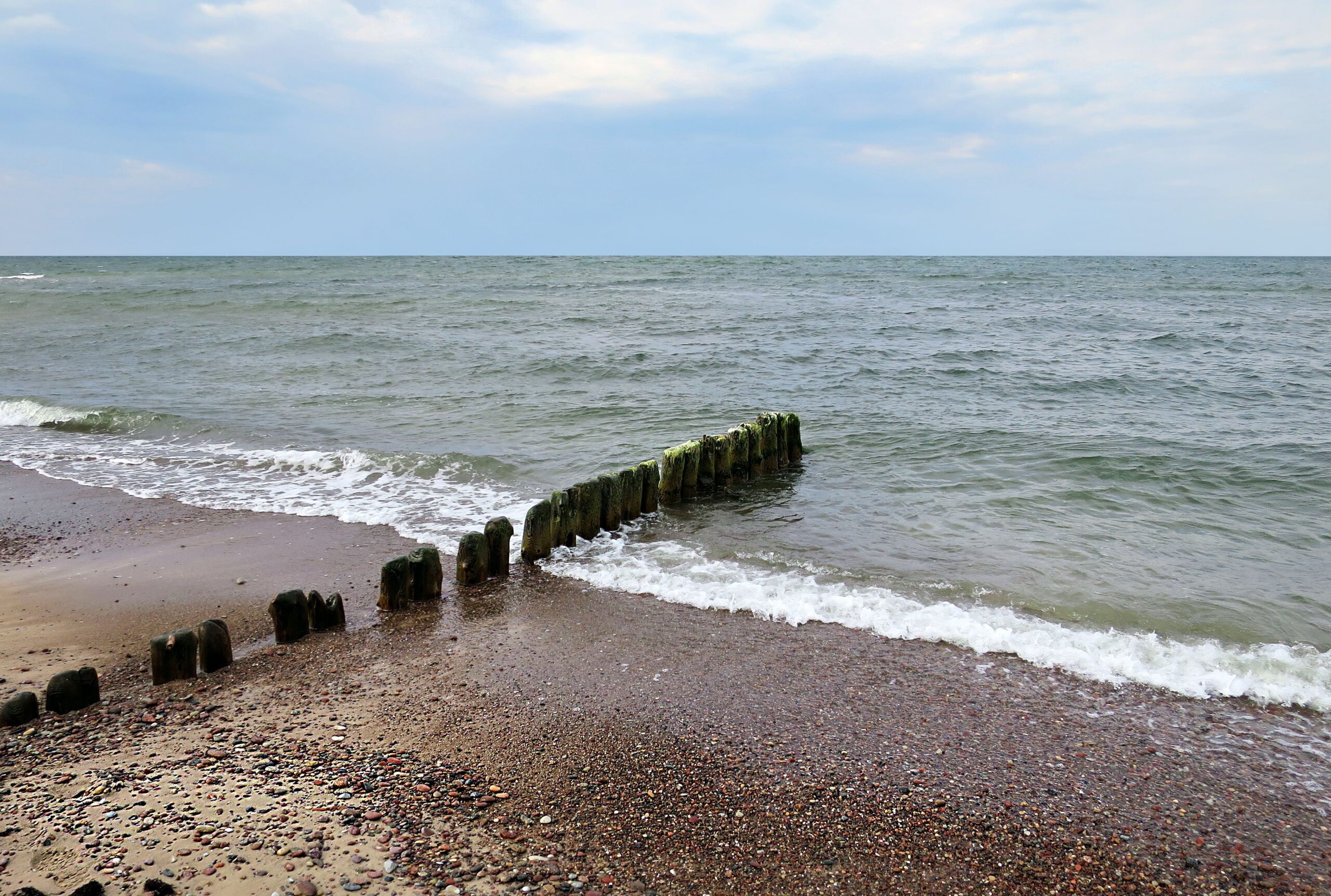 The Baltic Sea with wooden groynes on the Polish coast