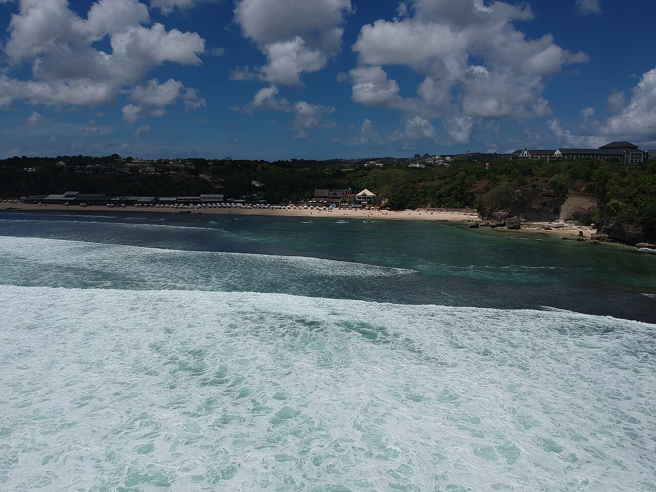 Balangan Beach with waves breaking over the reef